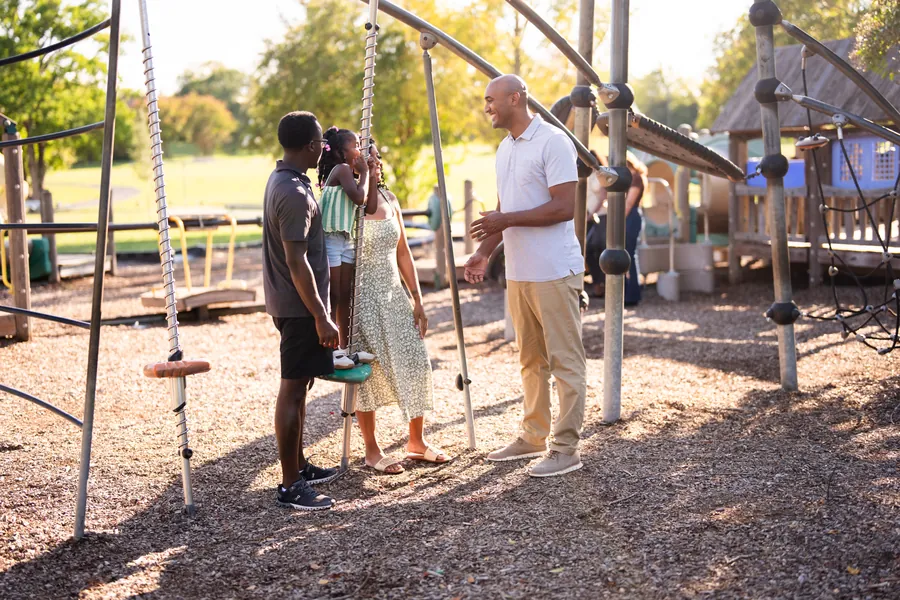 Shomari Figures with community members, photo 7 of 39