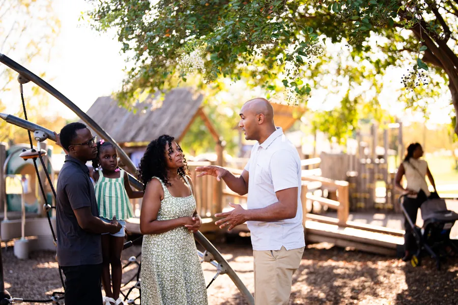 Shomari Figures with community members, photo 8 of 39
