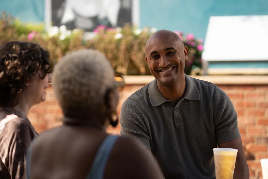 Shomari Figures with community members, photo 39 of 39